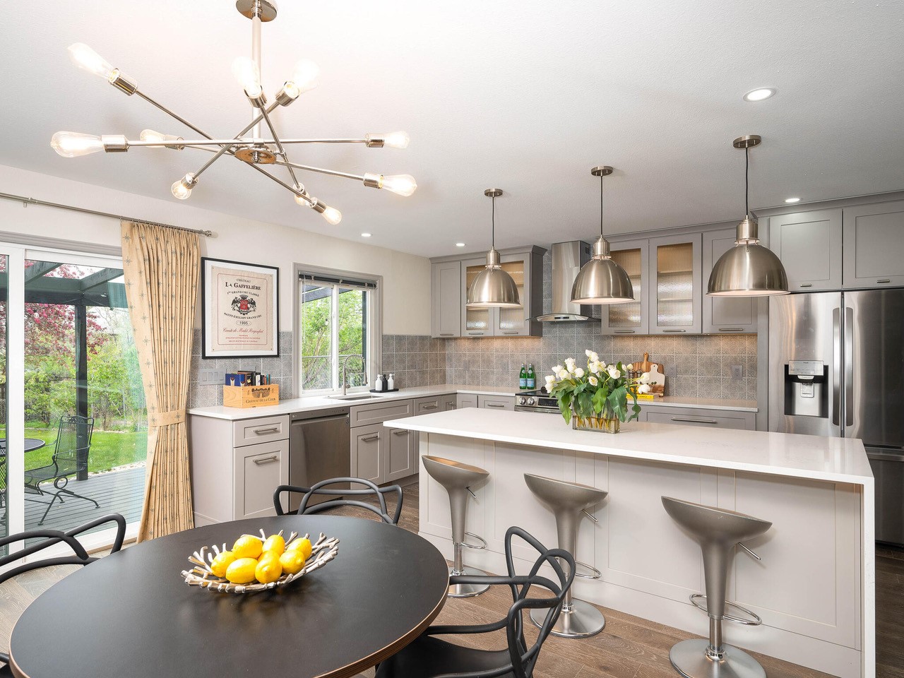 Modern kitchen with gray cabinets and a large island.