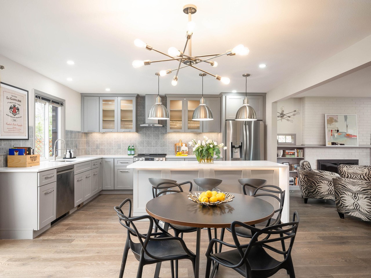 Modern open kitchen with island and dining area.